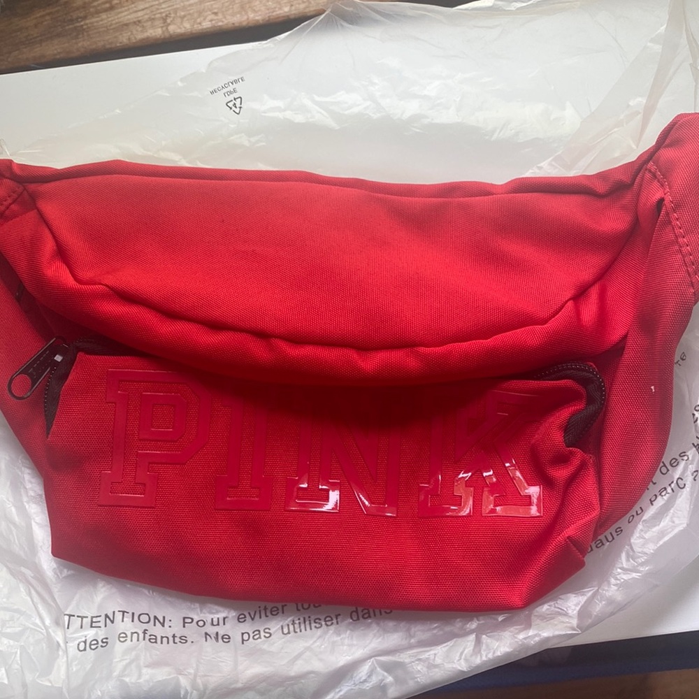 PINK over sized red Fannie pack. NLA, great color for the holidays.